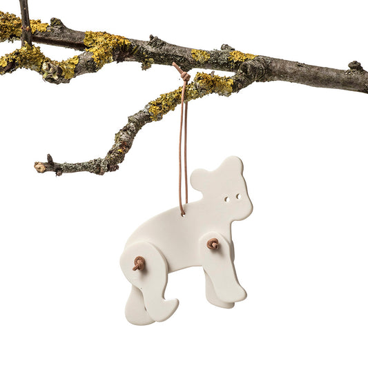 Ornament, pynt til ophæng formet som en bjørn med bevægelige ben og lædersnørre - designet af Louise Heisel